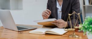 A lawyer working at a desk. Find out now if a Canton criminal defense lawyer can reduce or dismiss your charges.